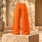 Buzo baggy liso algodón nacional naranja vista espalda fondo beige mediterráneo